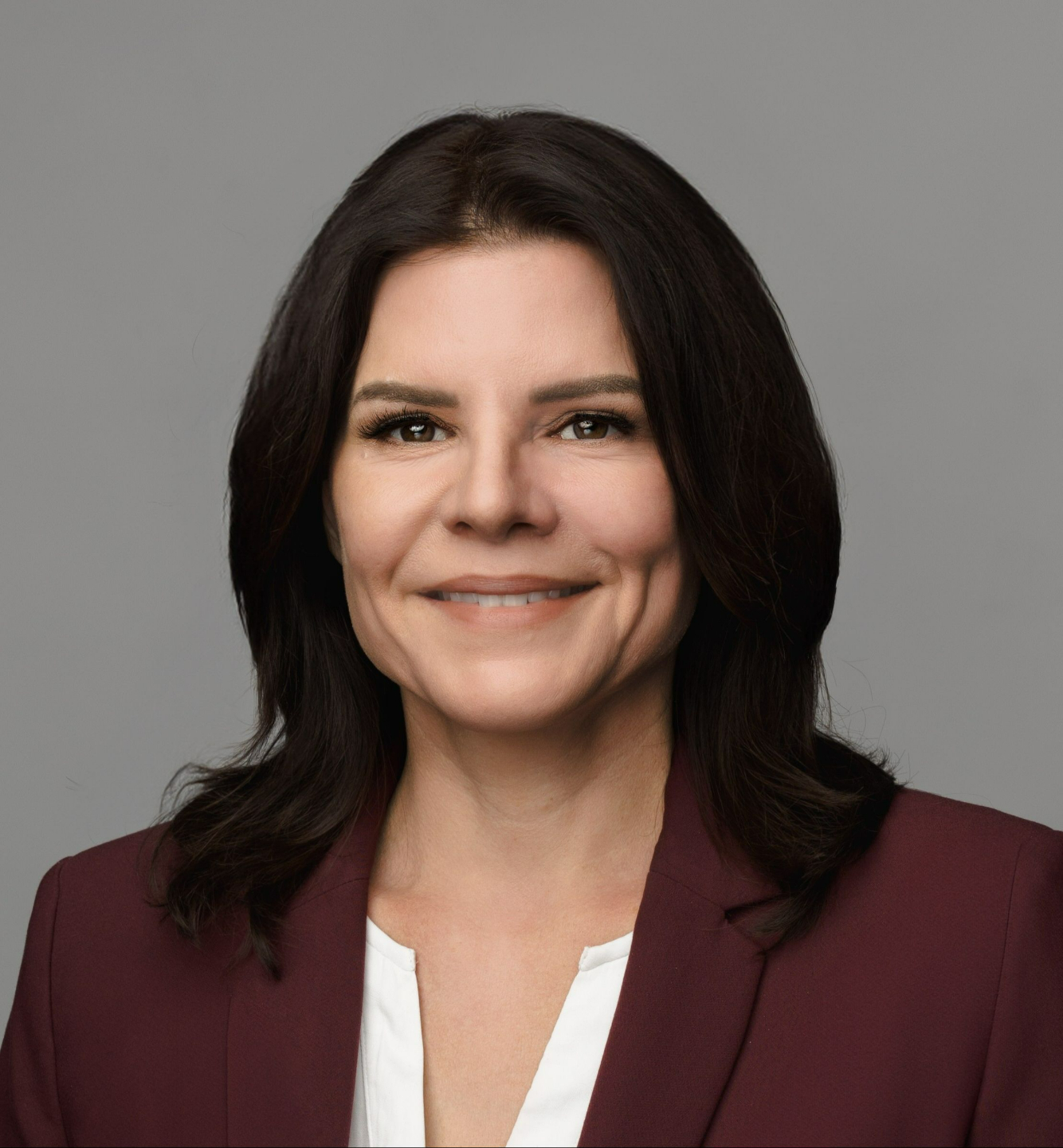 An image of Erin Merideth the founder of Unlearning Work LLC on the about page