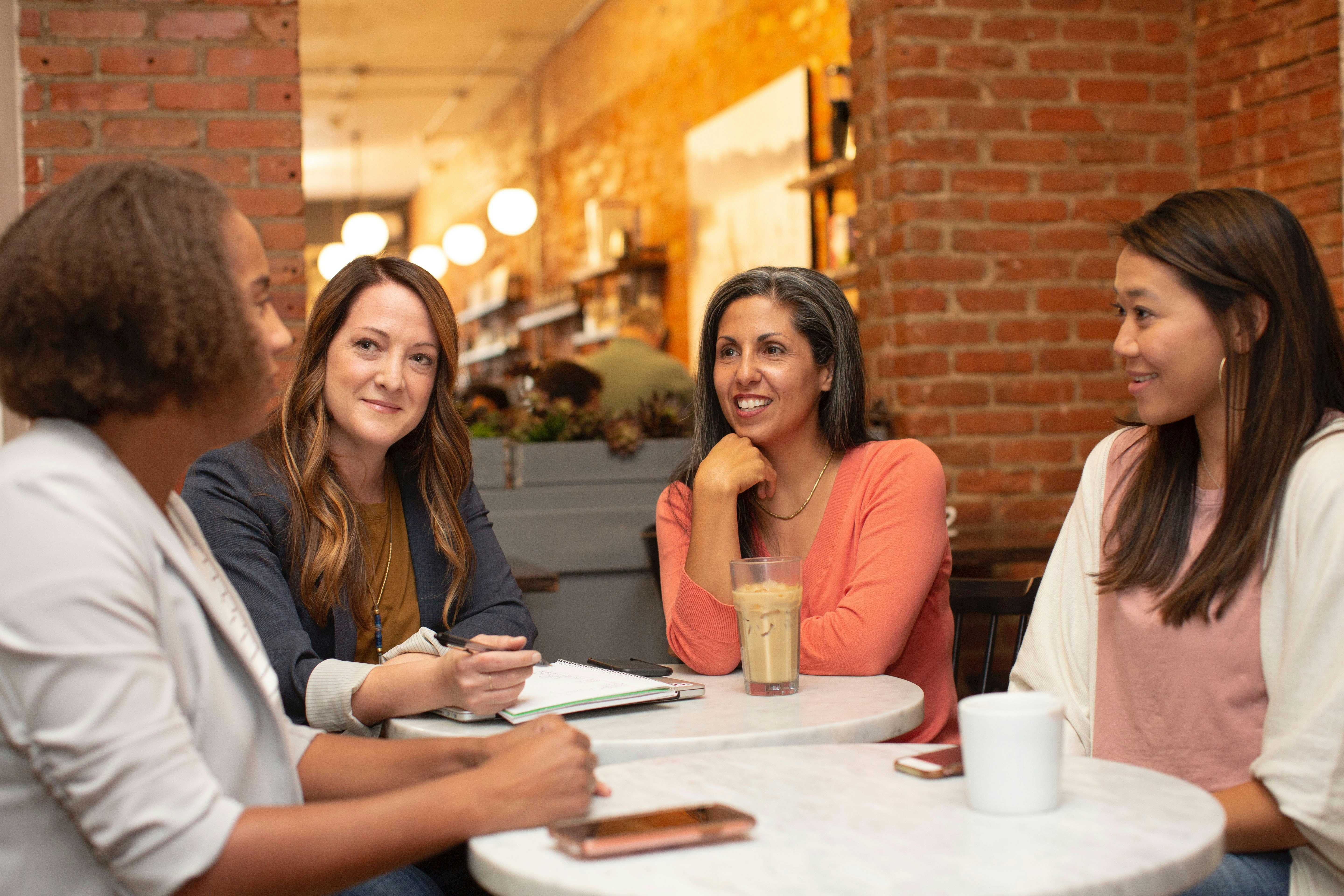 group of female friends chatting over coffee