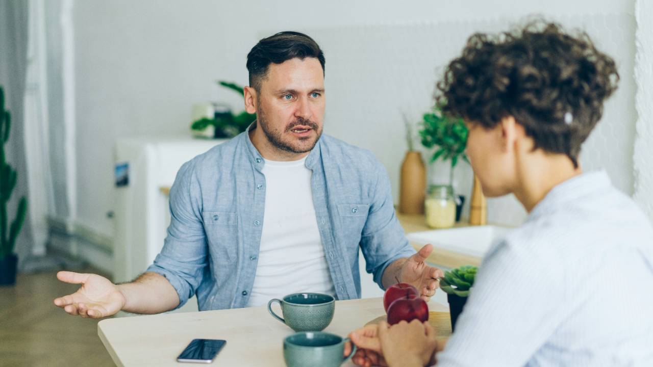Photo by <a href="https://unsplash.com/@silverkblack?utm_source=unsplash&utm_medium=referral&utm_content=creditCopyText">Vitaly Gariev</a> on <a href="https://unsplash.com/photos/a-man-sitting-at-a-table-talking-to-a-woman-yrSta3T5GDs?utm_source=unsplash&utm_medium=referral&utm_content=creditCopyText">Unsplash</a>