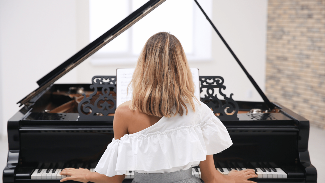 woman practising at the grand piano