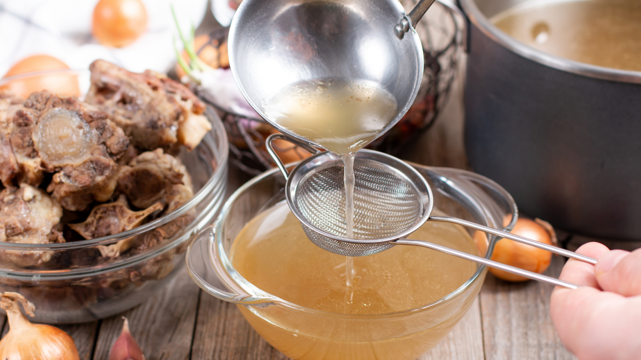 Bowl of bone broth and probiotic foods for a gut healing protocol