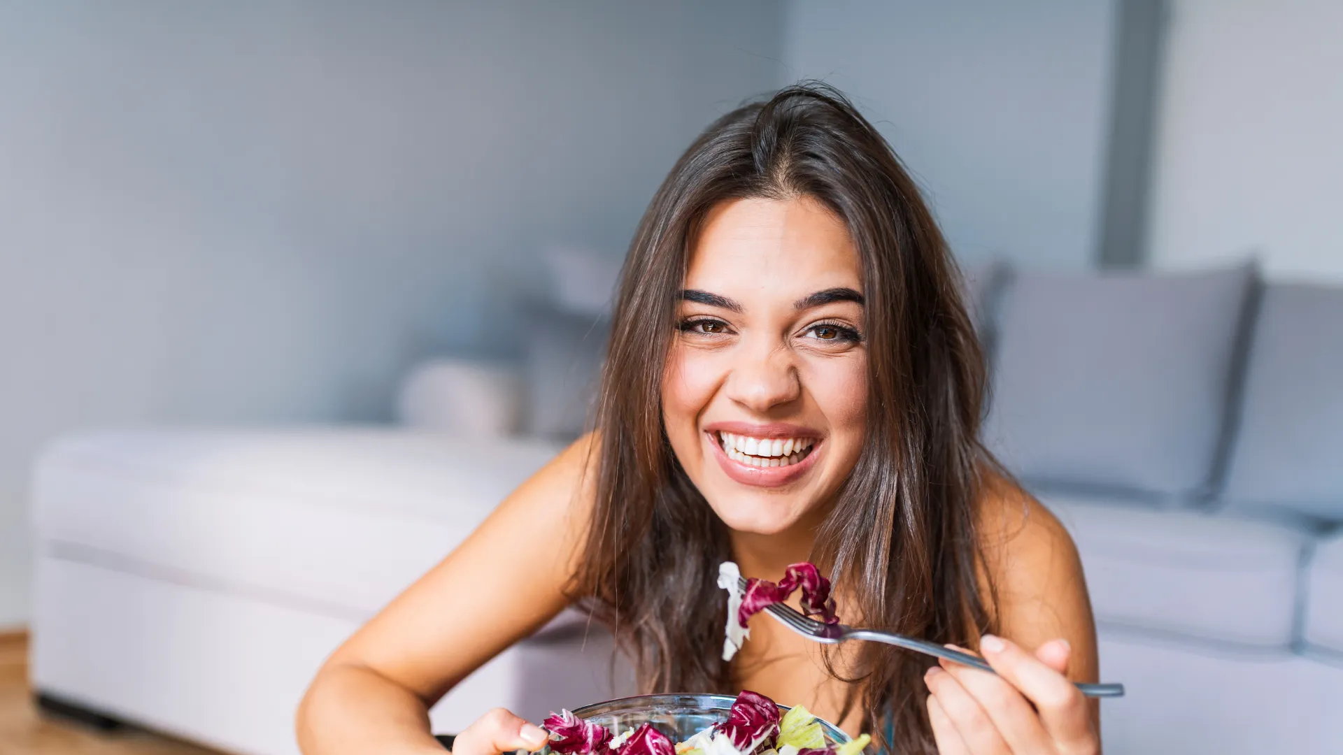 Woman over 40 enjoying a healthy meal during a guided detox and cleanse