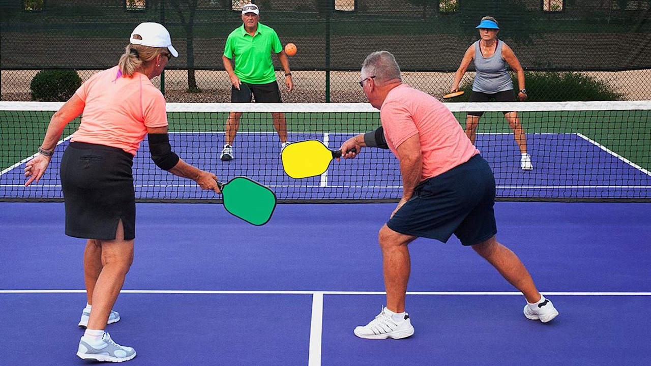 Active adults playing pickleball.