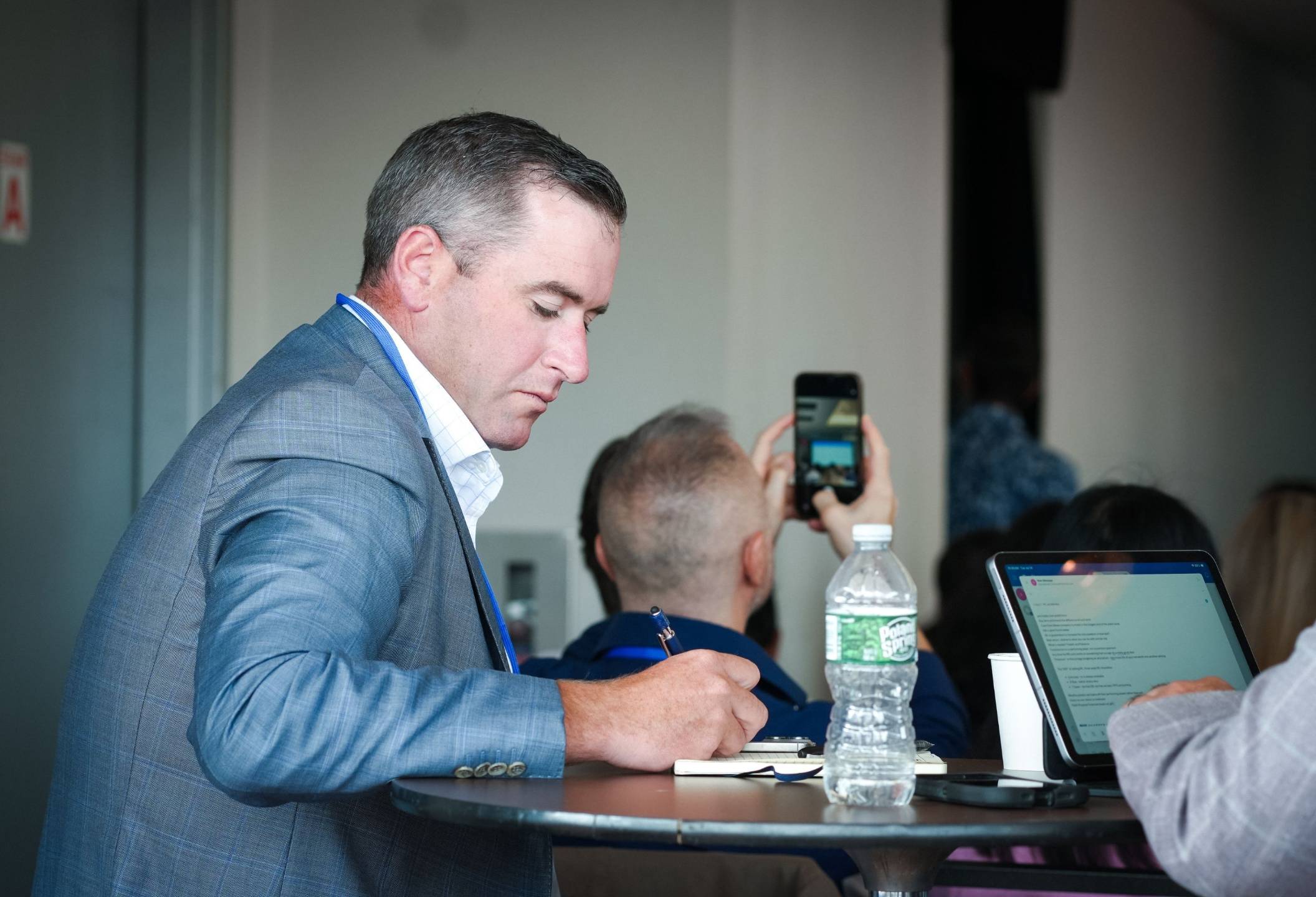 An advisor taking notes during a session