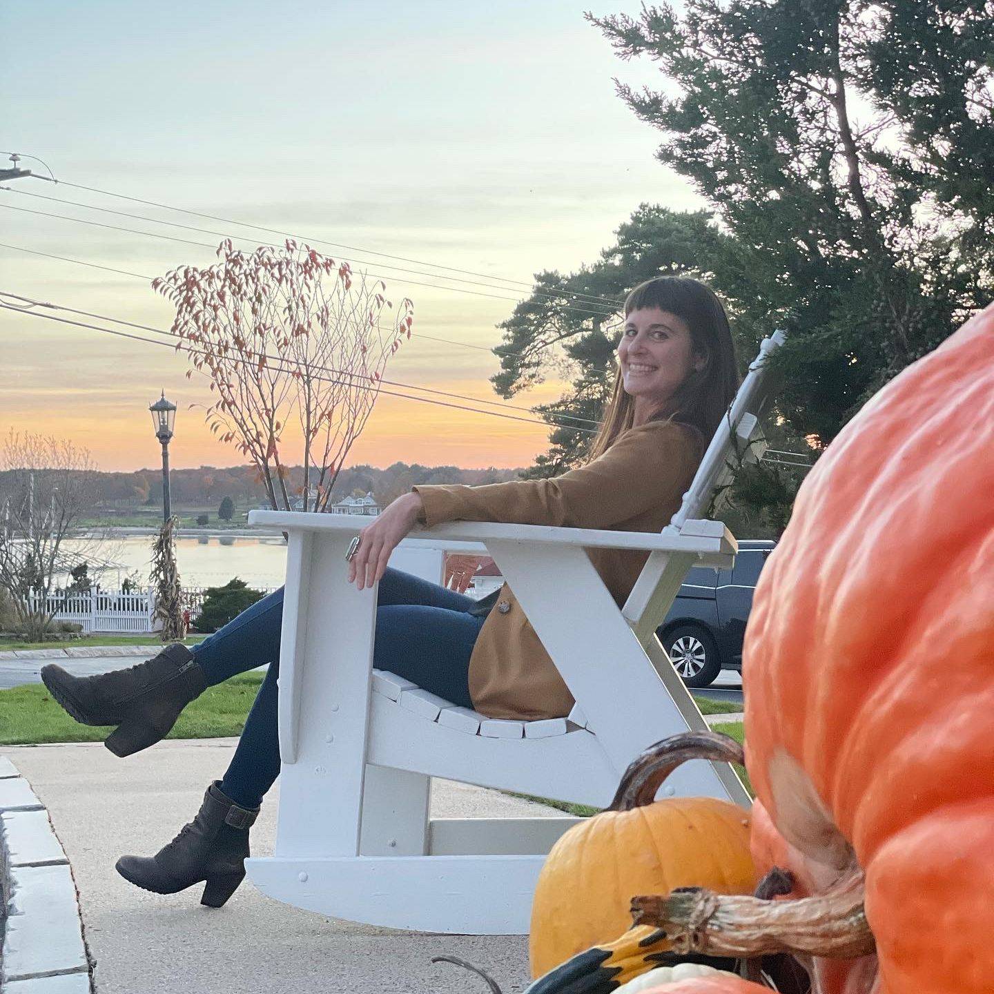 Dr. Tia Trivisonno relaxing outdoors at sunset, representing balance, confidence, self-care, and healthy aging through the Aging Into Vitality® program.