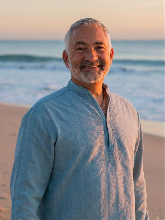 Tommy on the beach at sunset