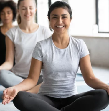 Women practicing yoga and meditation