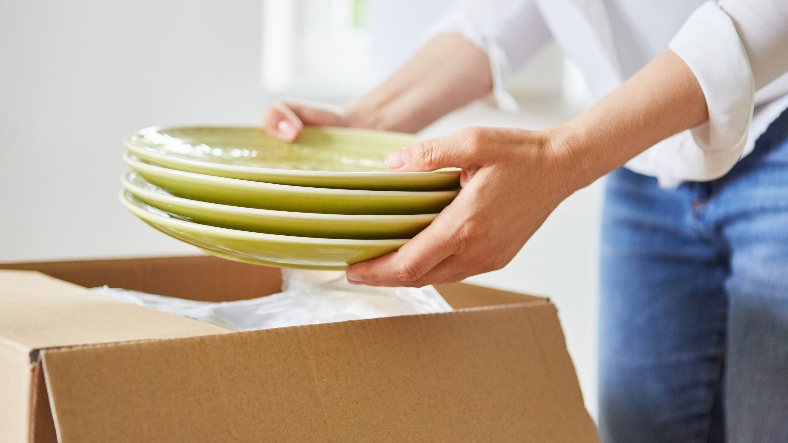 Stock photo of unpacked moving boxes in a home
