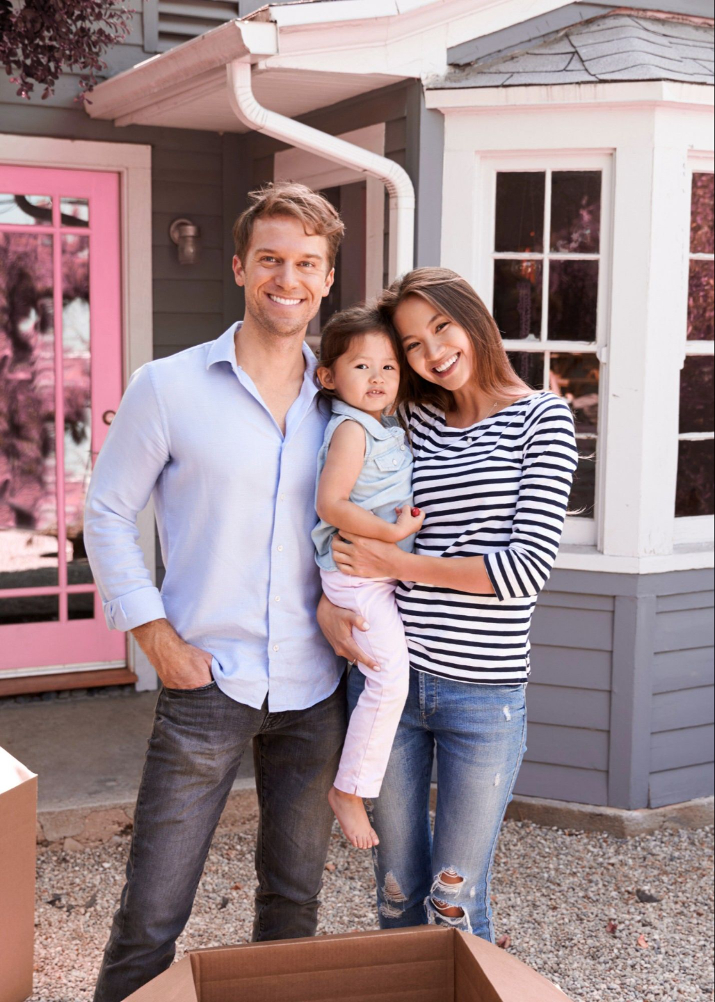 Family smiling in a home during a move