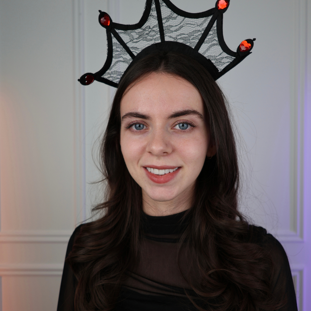 Clémence, French teacher and course founder, smiling in a cozy sweater