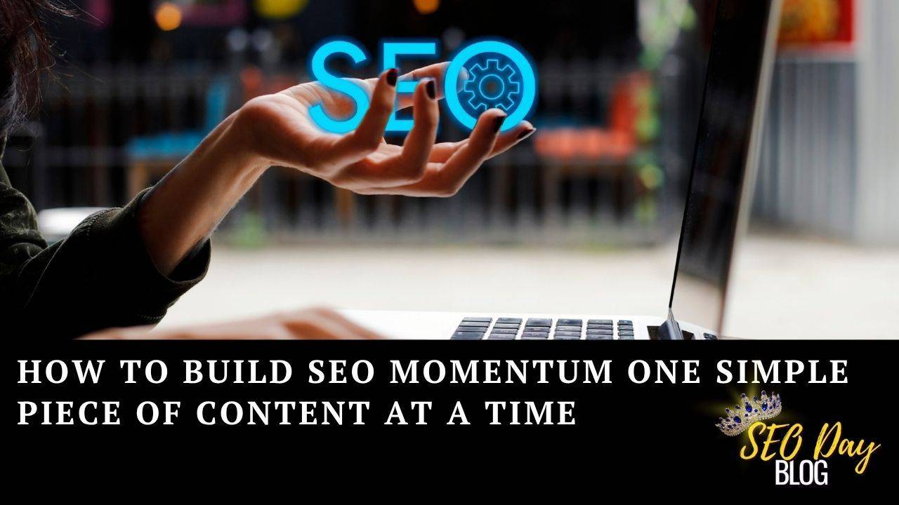 A hand over a laptop holding the letters SEO - build momentum with SEO one piece of content at a time as a title