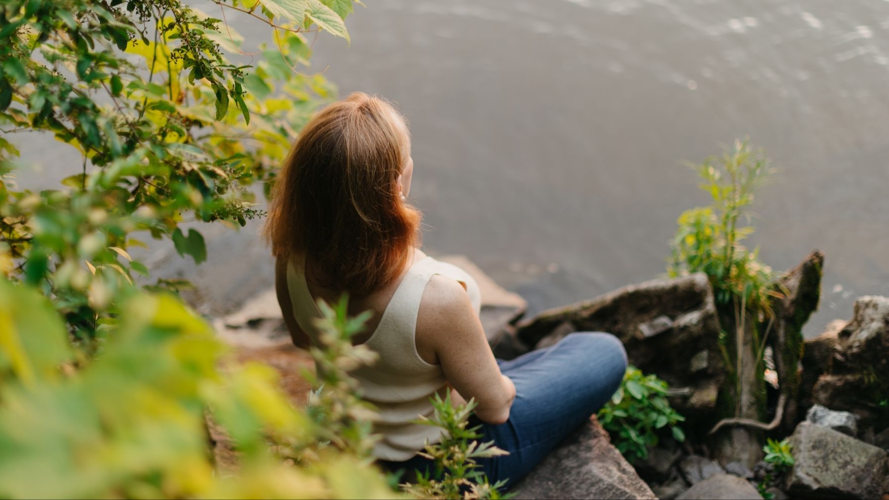 Caitilin Twain meditating by river
