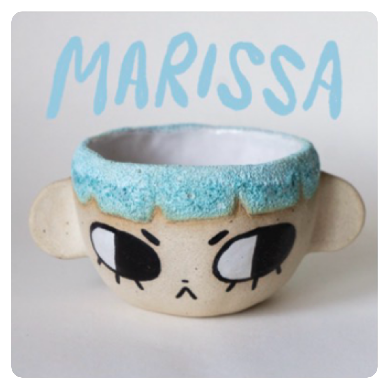 Ceramic mug with a sculpted caterpillar handle