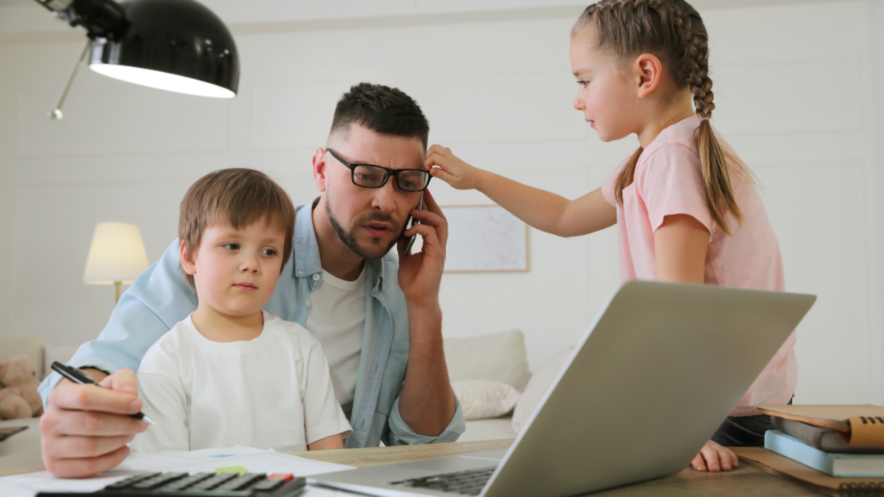 Busy parent balancing work and childcare while managing tasks at home