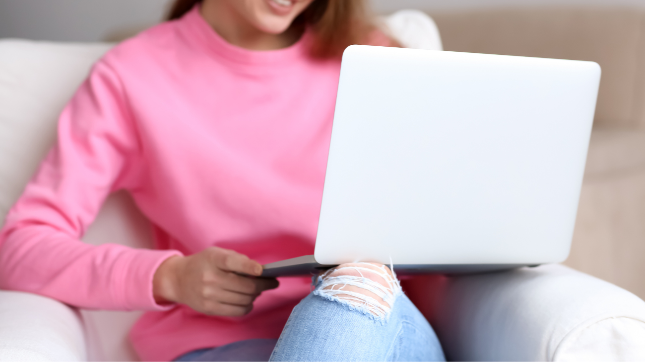 Woman on laptop, working from home as a Virtual Assistant. 