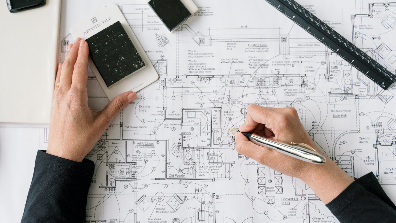 Vermont interior designer reviews renovation blueprints for remodel being done in phases