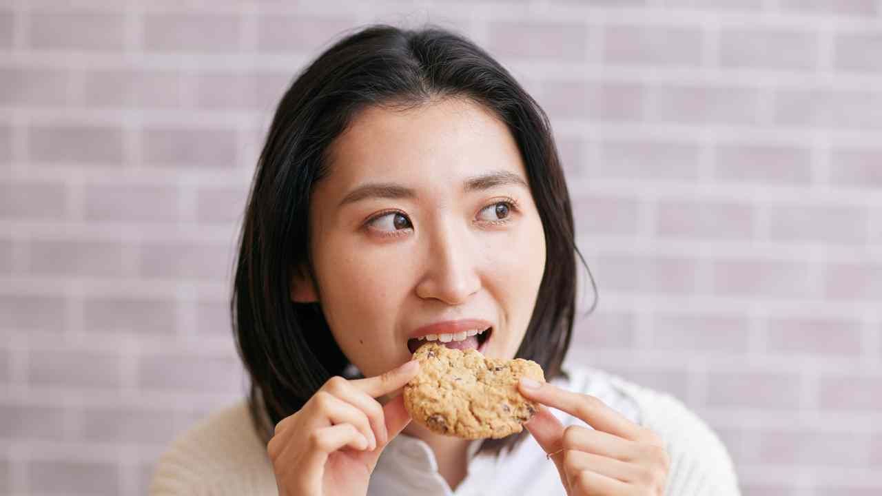 woman eating a cookie