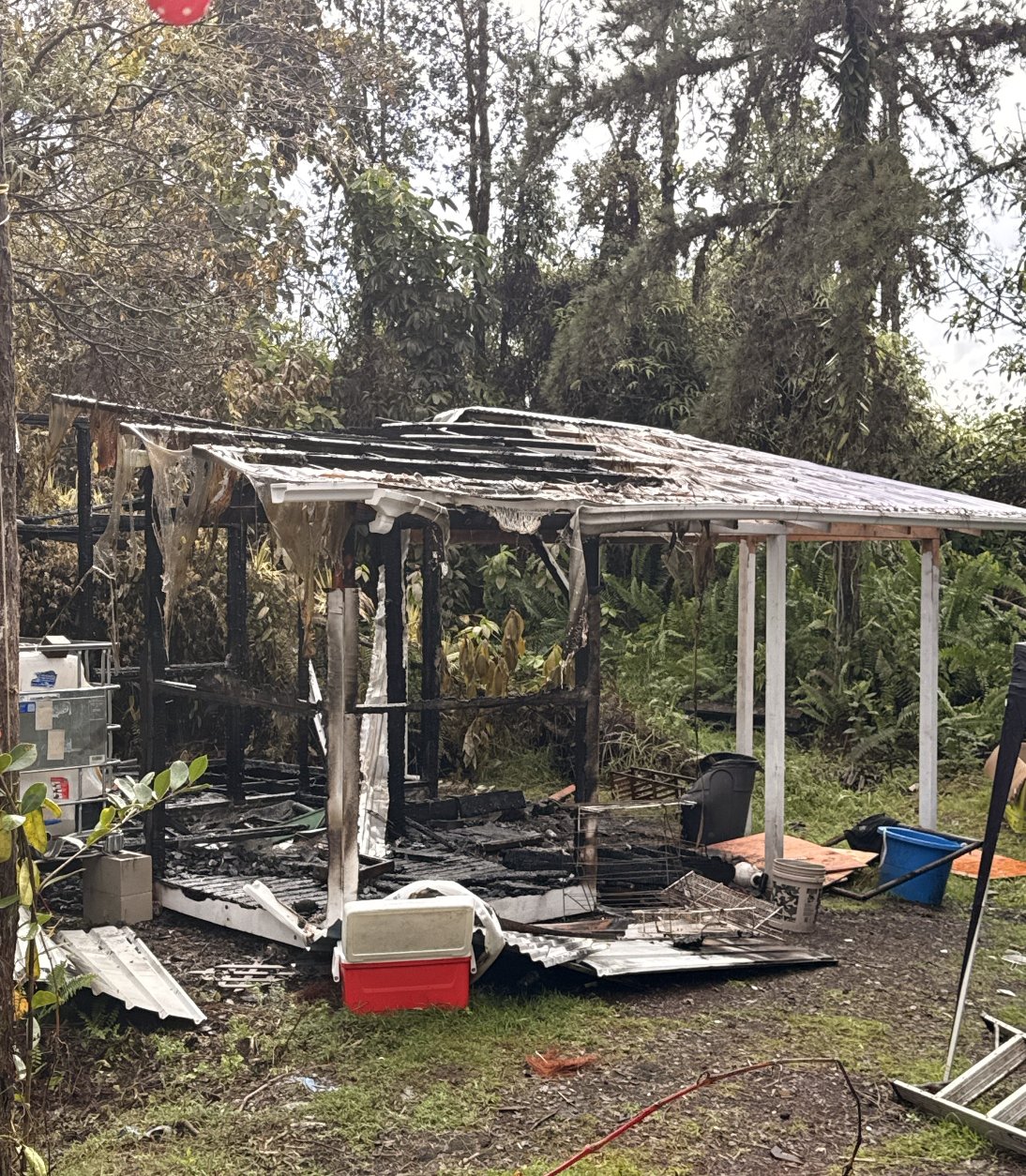 The burned remains of a structure Amber built