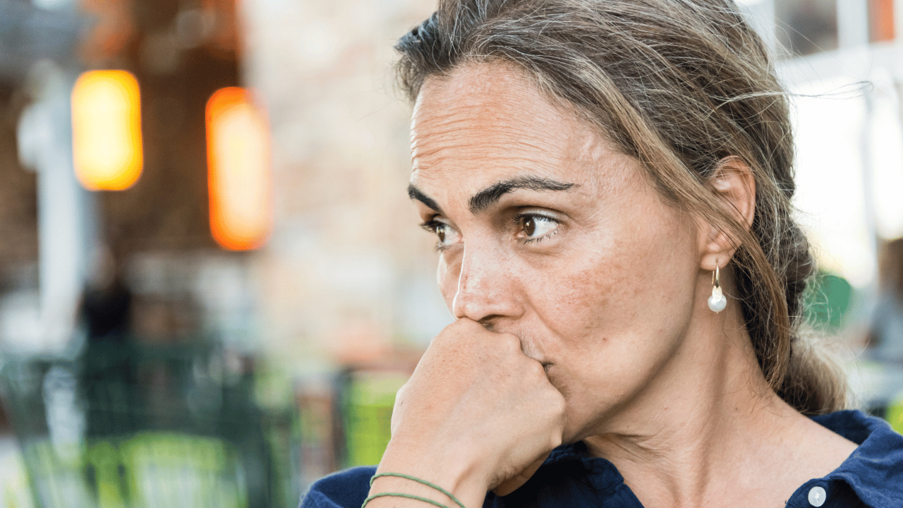 Women worrying about having to mask her menopause symptoms while coping with her day