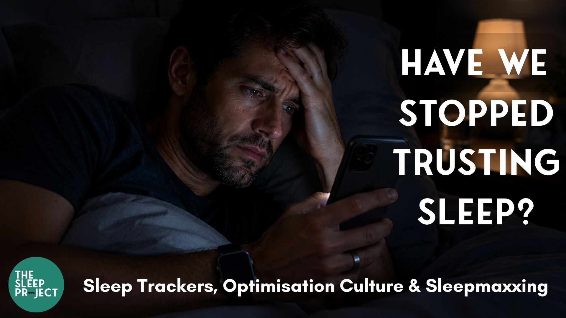 A man wearing sleep trackers at night: Apple Watch and Oura Ring