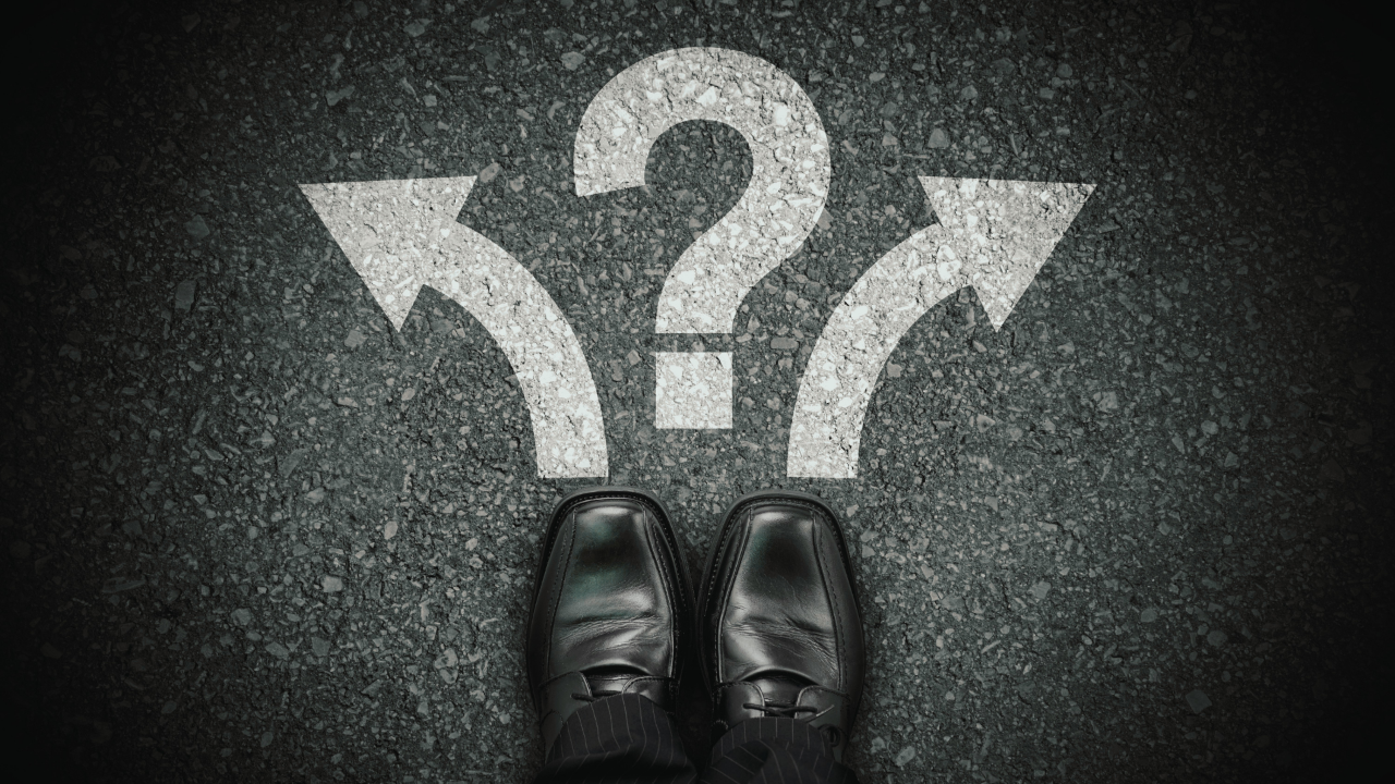 MDL Blog Image Showing Mans Shoes At Bottom With A Question Mark Above It and Two Arrows Pointing In Opposite Directions Either Side to Represent Decision Making