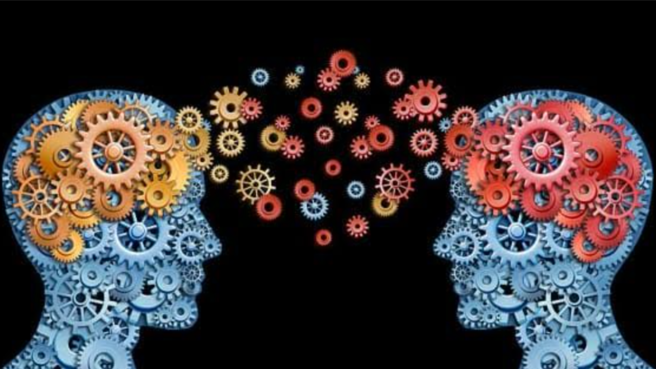 Heads made of gears connecting via a trail of gears between, symbolizing the therapeutic relationship with an expert Michigan therapist.