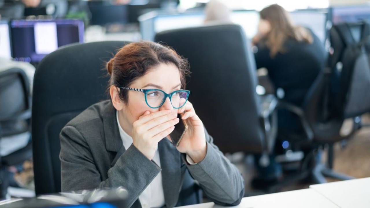 A woman crying in front of her female manager at a restaurant..