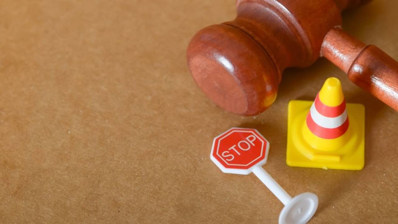  Table with gavel, stop sign and traffic cone