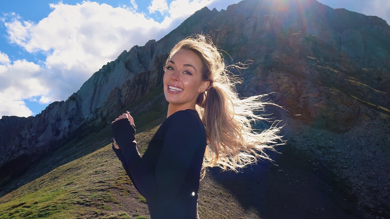 Brittany Arnason running in the mountains of Canada.
