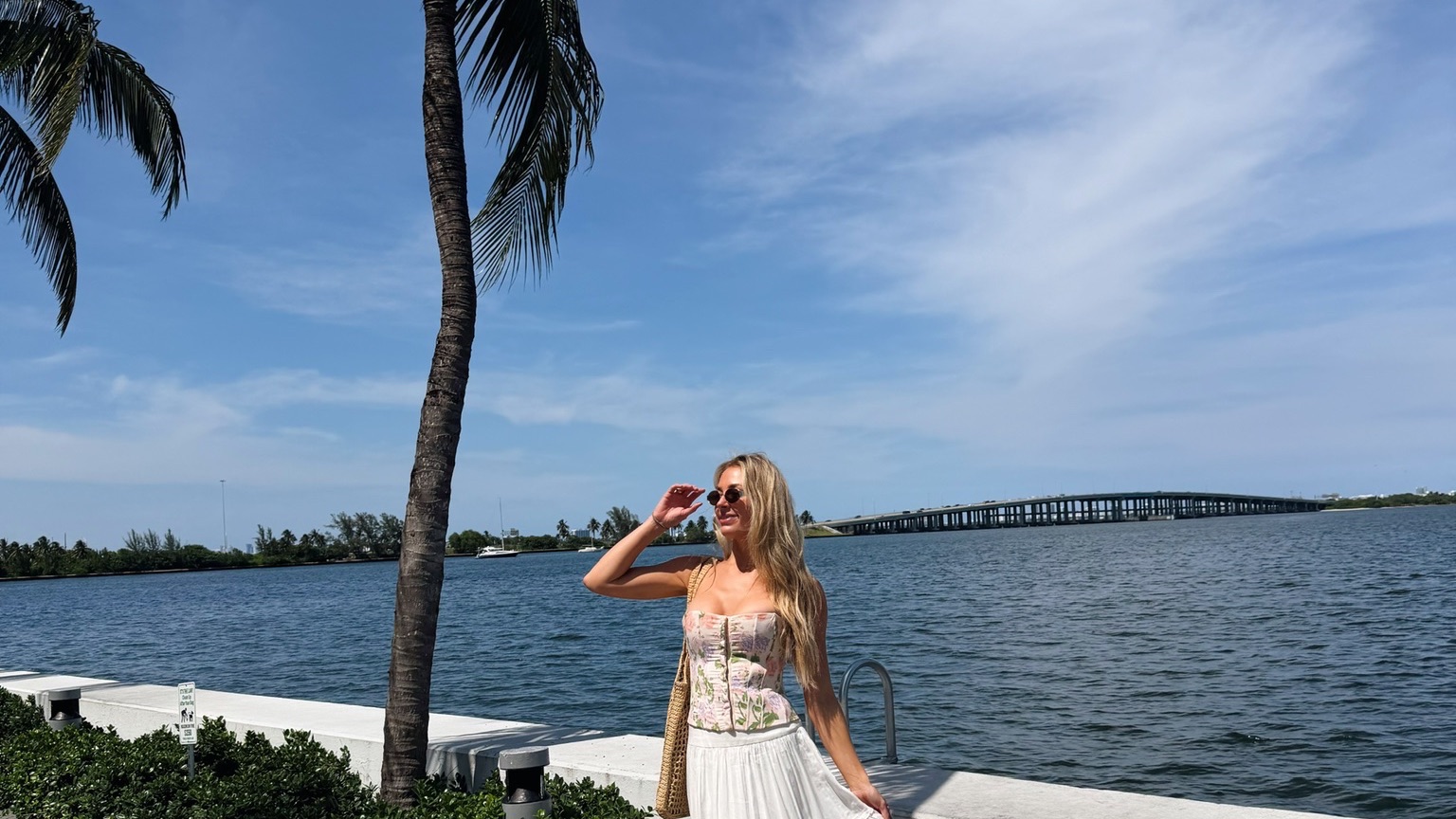 Brittany Arnason in the sun at a waterfront in Miami.