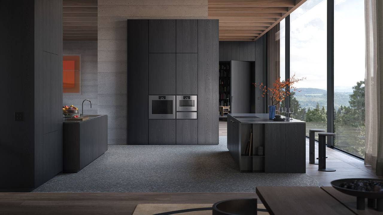 Minimalistische keuken met Gaggenau Expressive bakoven, combistoomoven en warmhoudlade, walnoothouten kasten, travertin kookeiland en subtiele herfststyling.