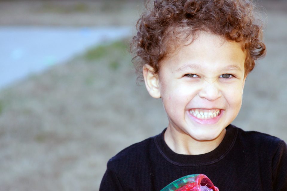 A smiling boy around age six