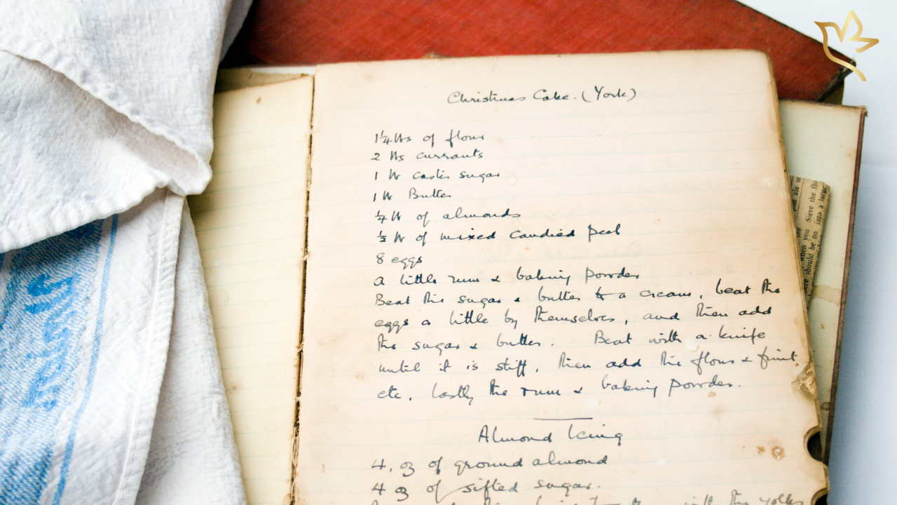 A treasured handwritten family recipe rests on an open cookbook, symbolizing the comfort of familiar traditions passed lovingly from one generation to the next.