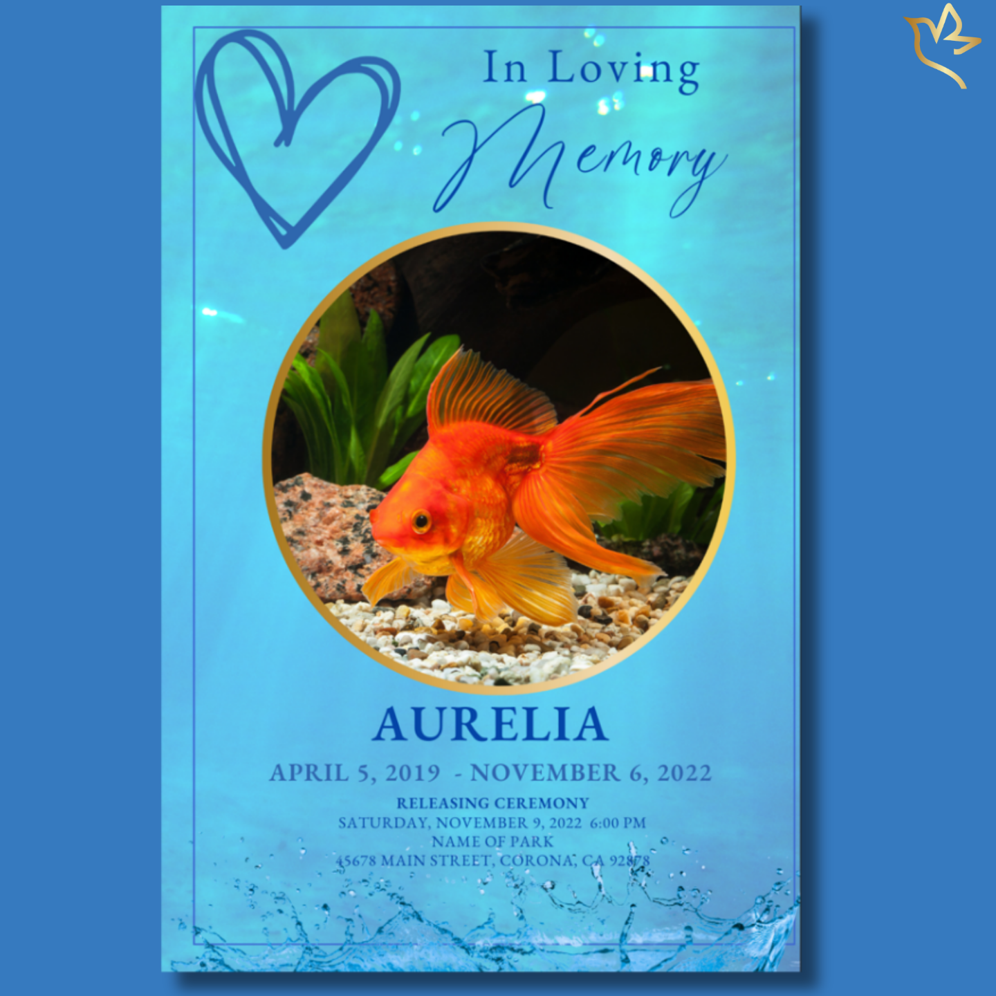 Bright underwater-blue background with a goldfish centered inside a circular portrait frame, gold border accents, a hand-drawn blue heart near the title “In Loving Memory,” and memorial details displayed beneath.