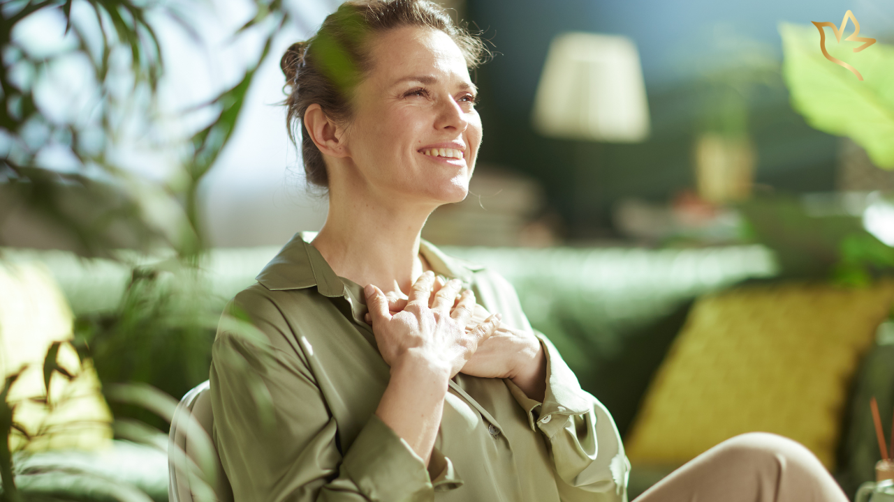 Grateful woman with her hands over her heart reflecting on the kindness of people who donated to a funeral fundraiser.