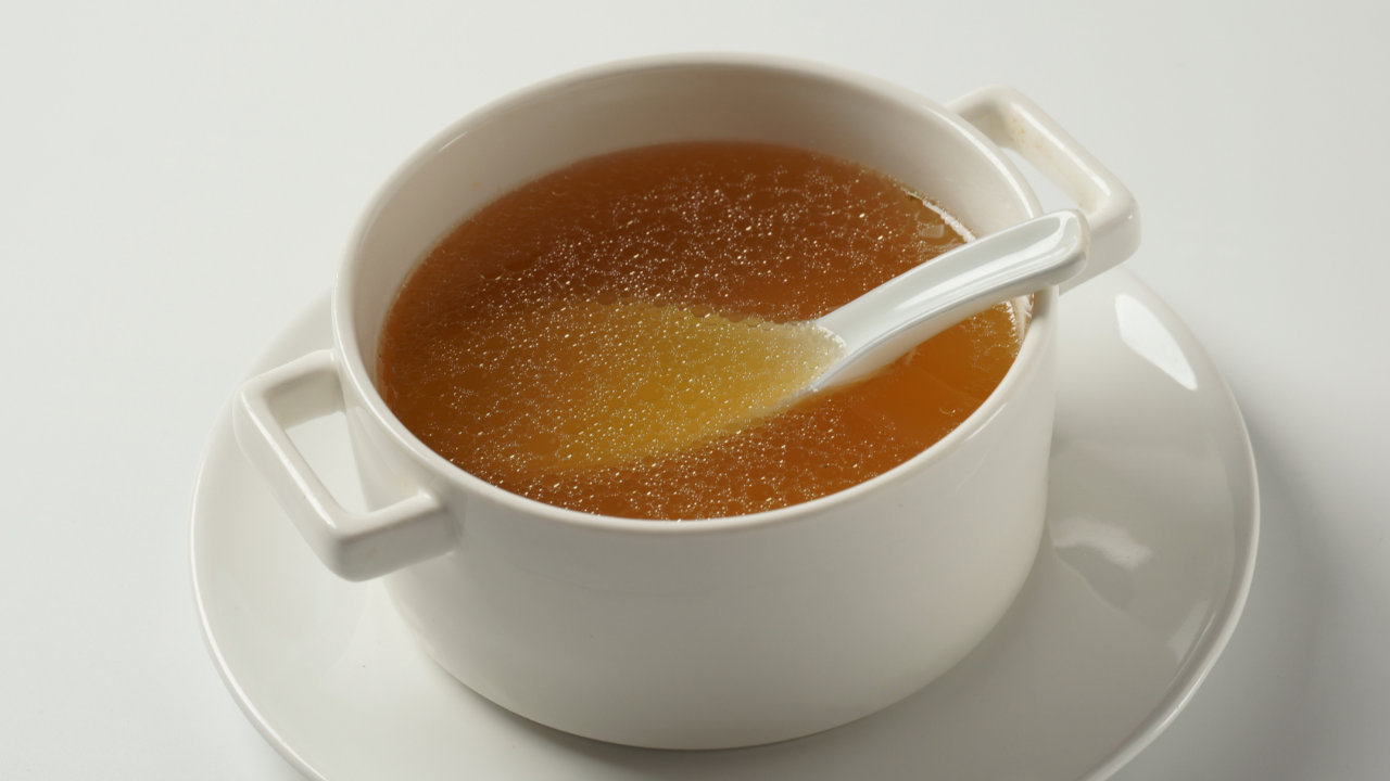 Bowl of bone broth with spoon
