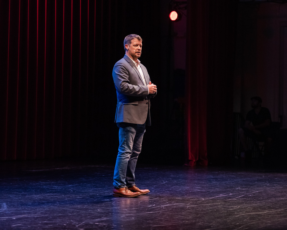Dr. Shane Smith speaking on stage