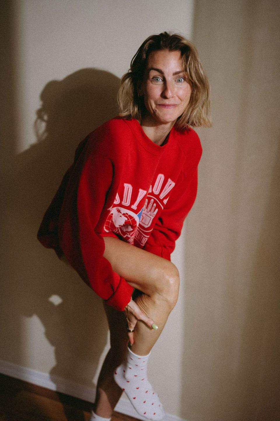PLACEHOLDER — Photo: portrait in red varsity sweater, polka-dot socks