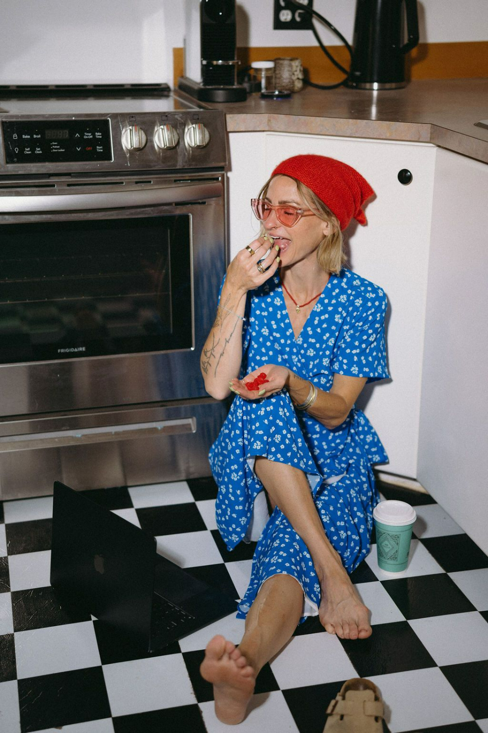 PLACEHOLDER — Hero photo: Robyn in blue dress on kitchen counter, checkered floor
