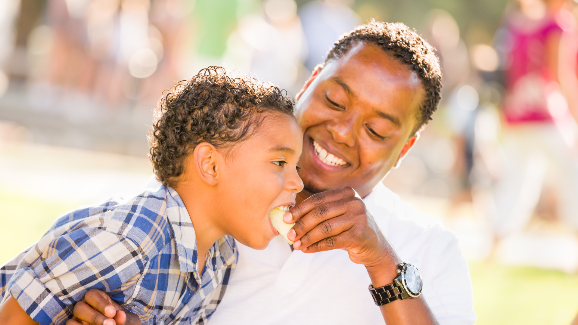 Therapist working with a child on feeding and mealtime skills