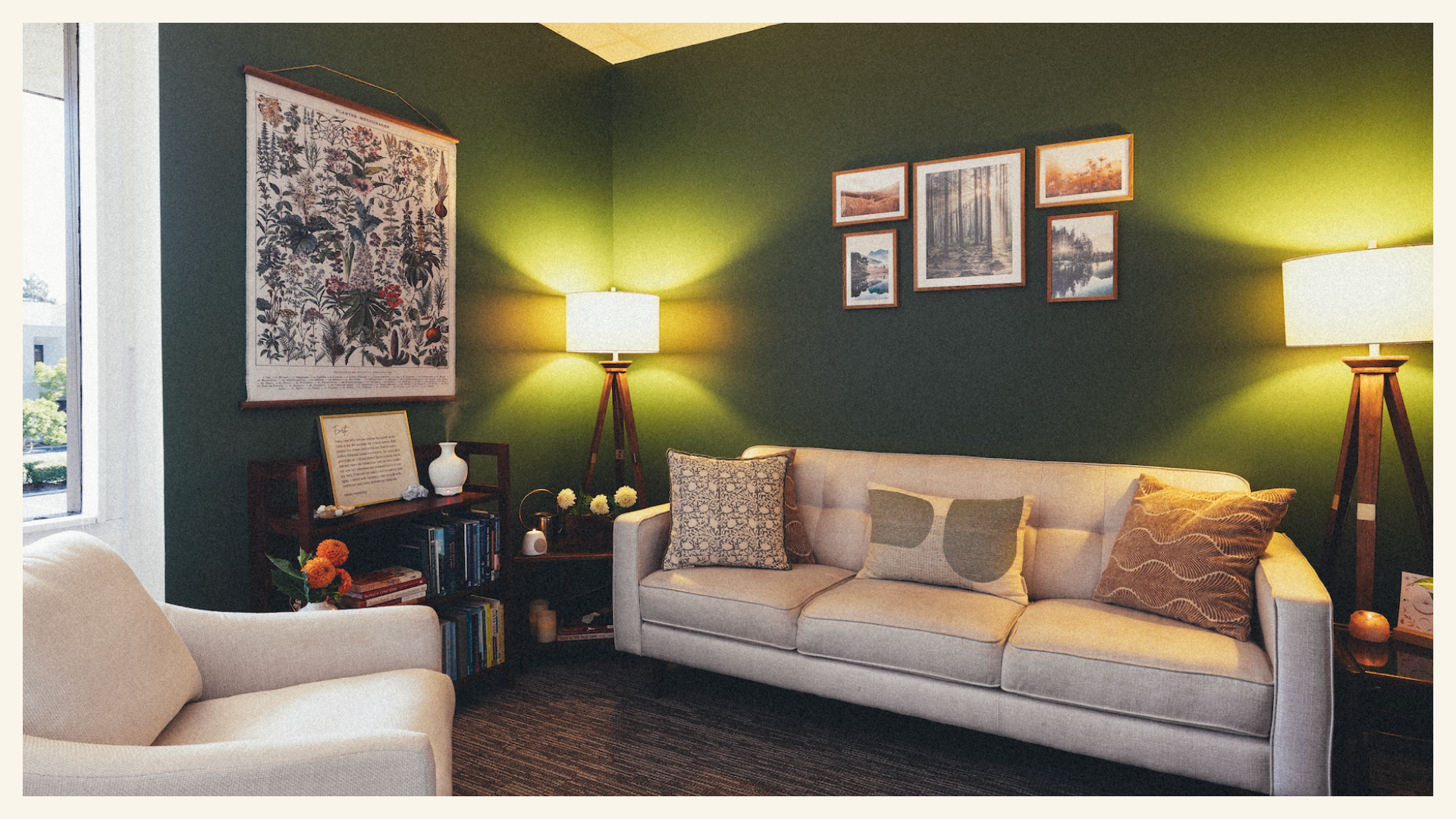 Summon Courage mid-century style therapy office with white sofa, white chair, green wall and floor lamps — Orange County California