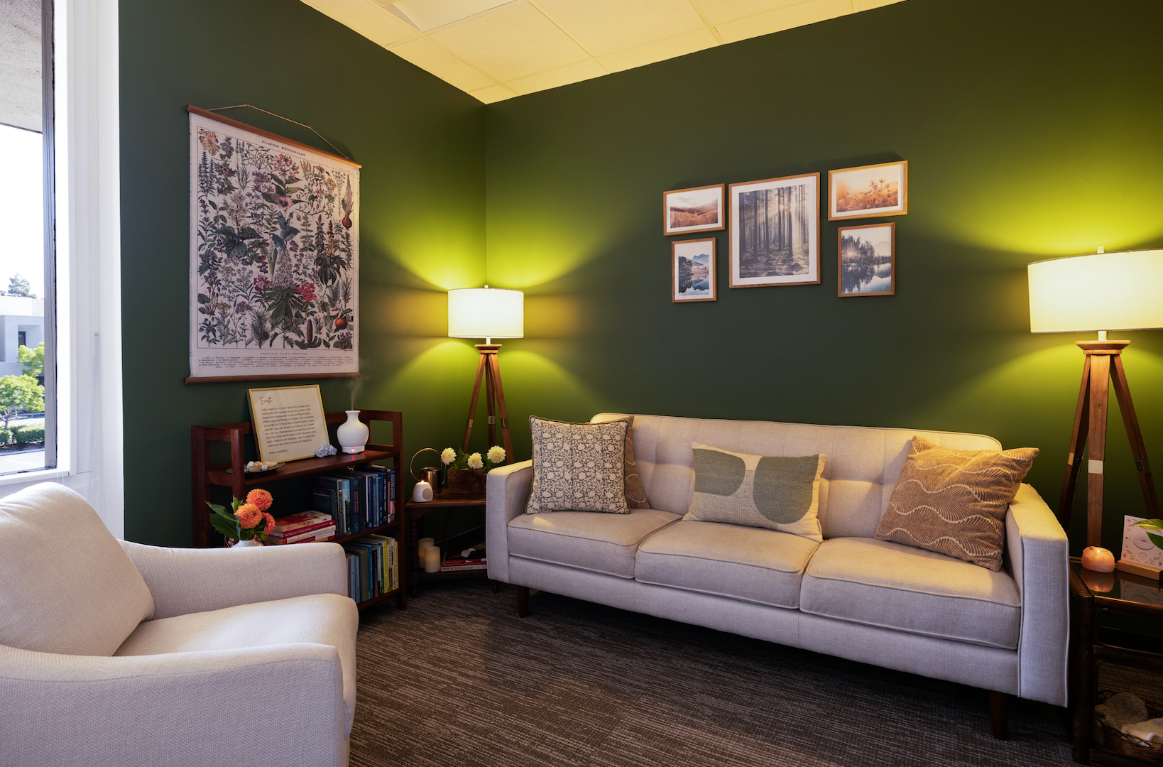 Summon Courage therapy office with chair, sofa, mid-century lights and a green wall — somatic psychotherapy for anxiety and trauma in Orange County CA