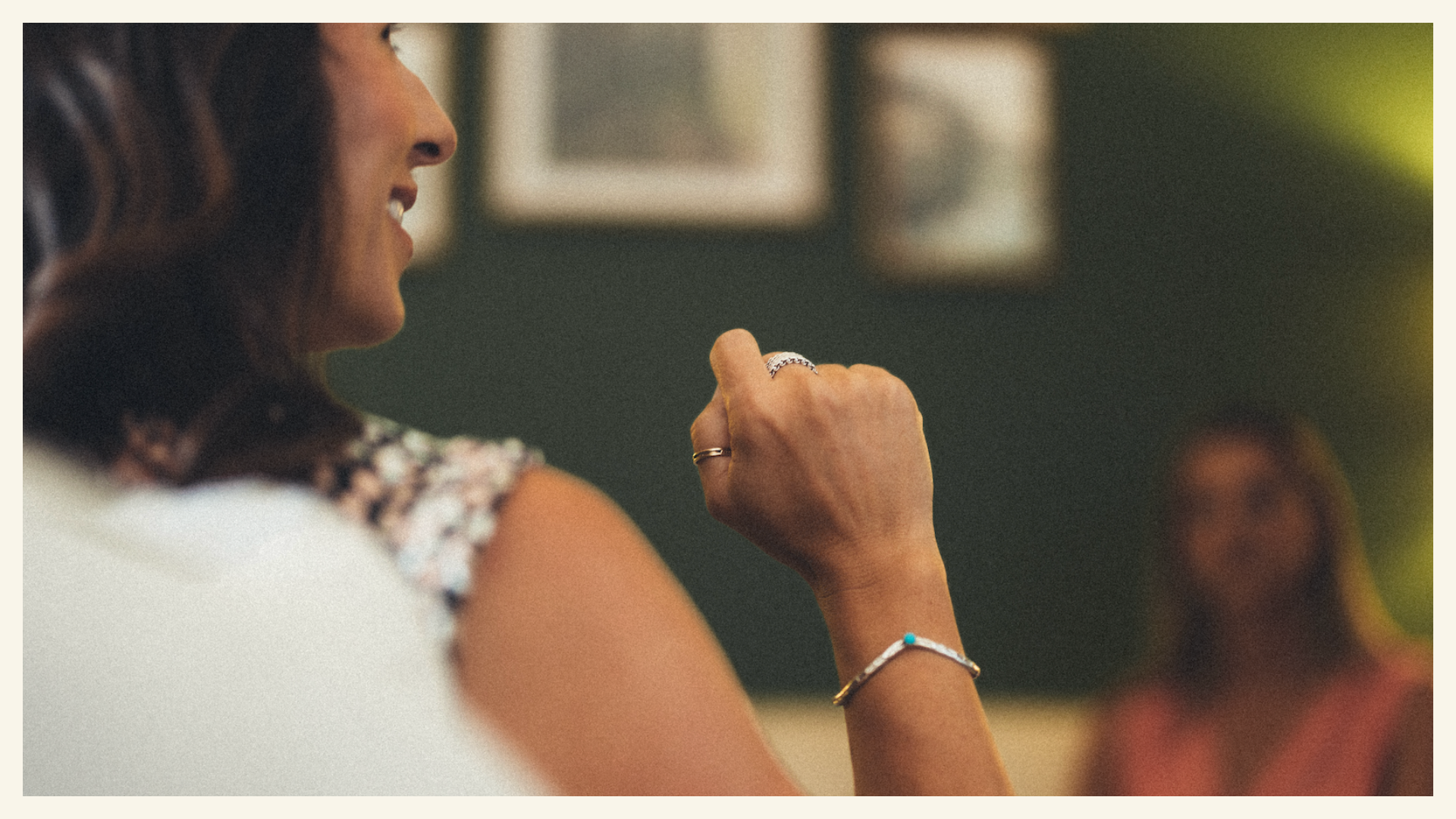 Close up of Lesley Tate-Gould's side profile, hand and a client in the background — Somatic Therapy Practice in Orange County California