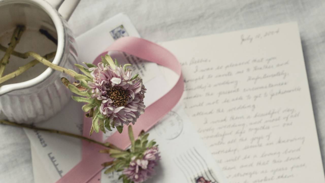 letters of intimacy surrounded by flowers