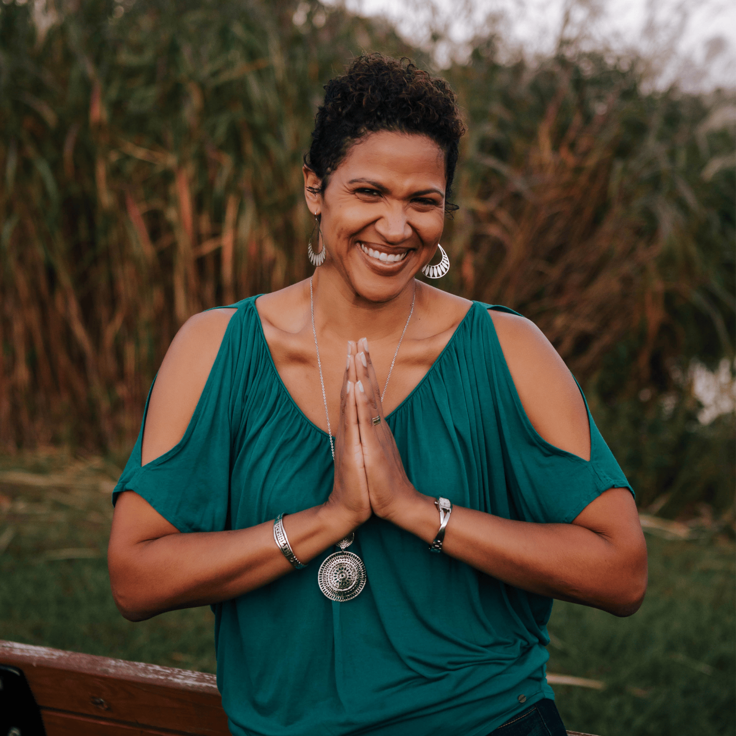 Woman holding her hands together in her front of her chest