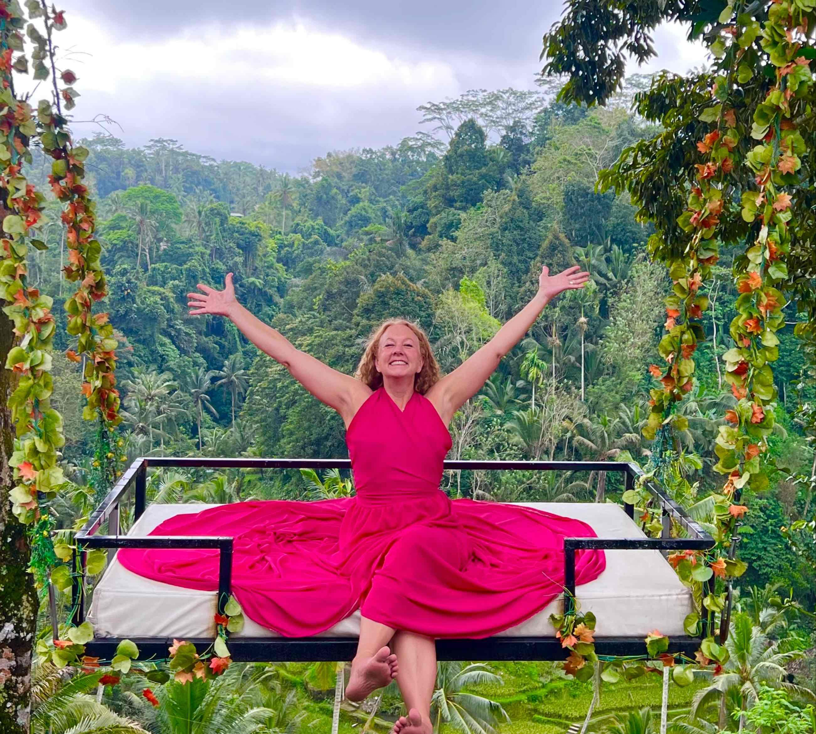 Joyful, arms open on a jungle swing — free and fully alive