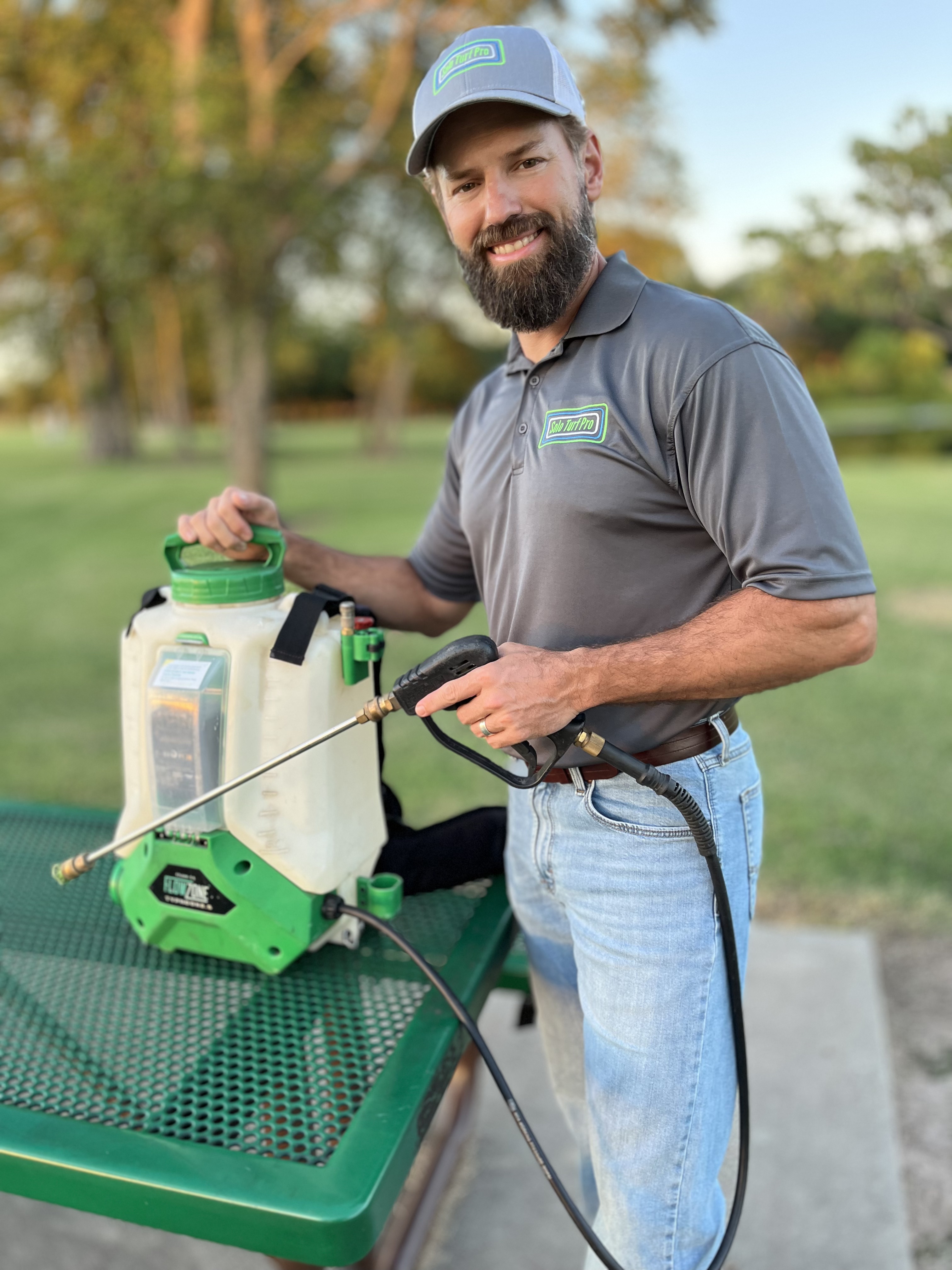 Jason Spears holding his backpack sprayer