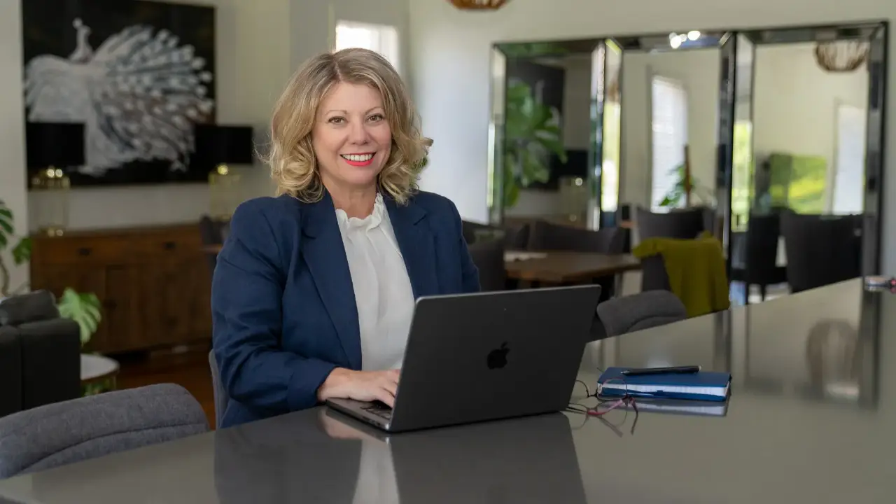 Deb Szabo reviewing a Brand DNA knowledge file used to help AI create on-brand written and visual content.
