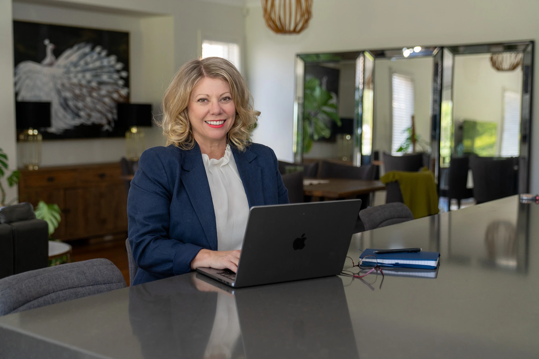 Deb Szabo working at her laptop