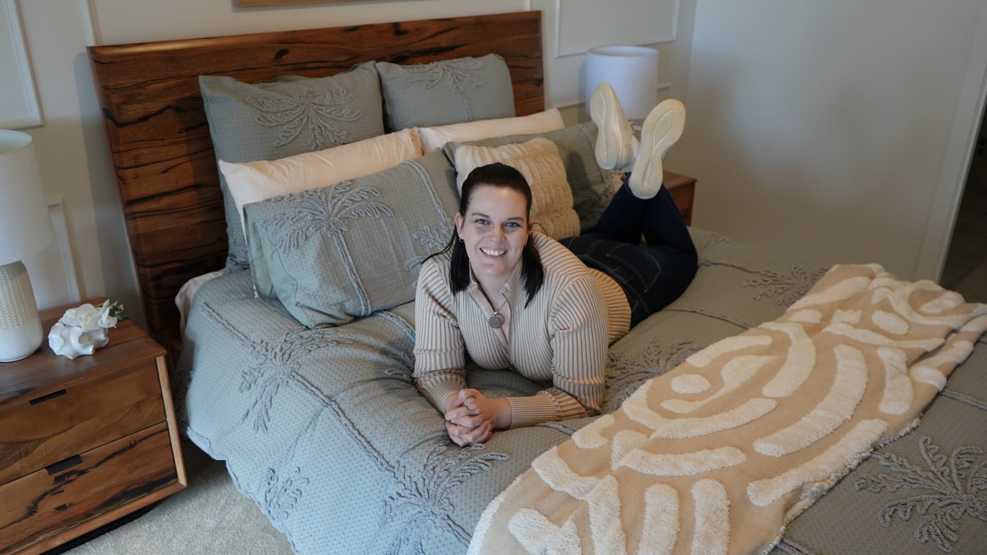 Jade relaxing in her styled bedroom